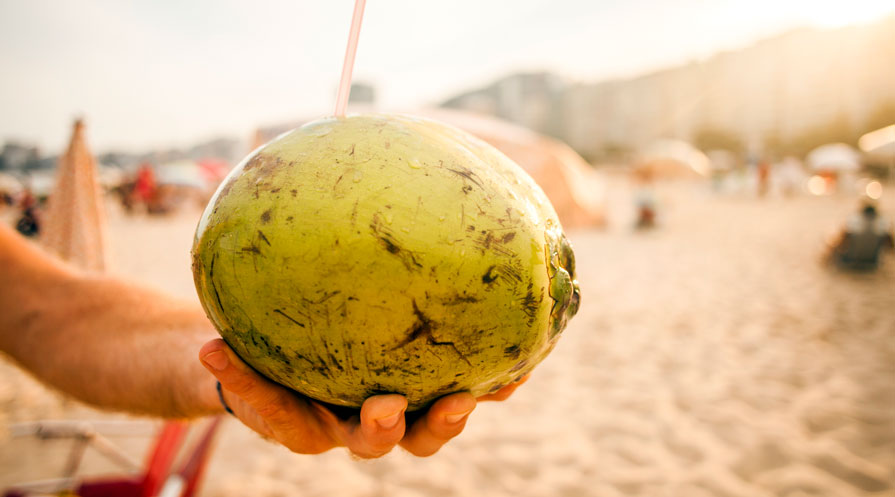 hands holding coconut