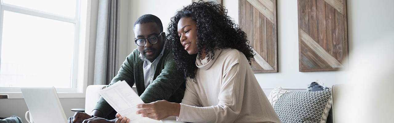 A couple looking at paperwork together